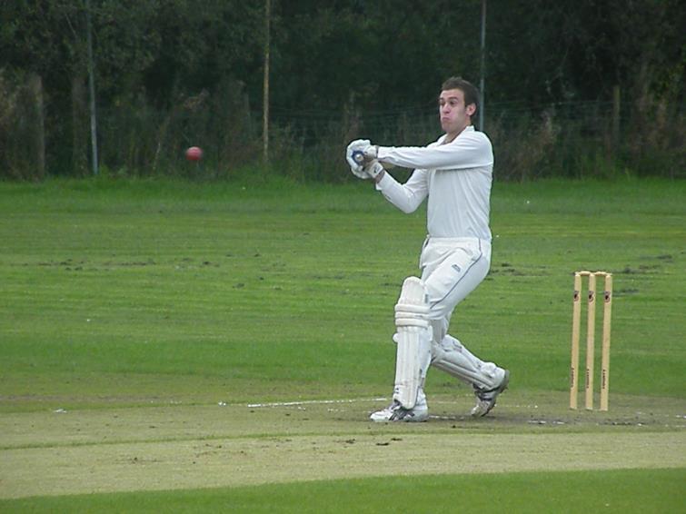 Danny Caine hits a four for Lawrenny